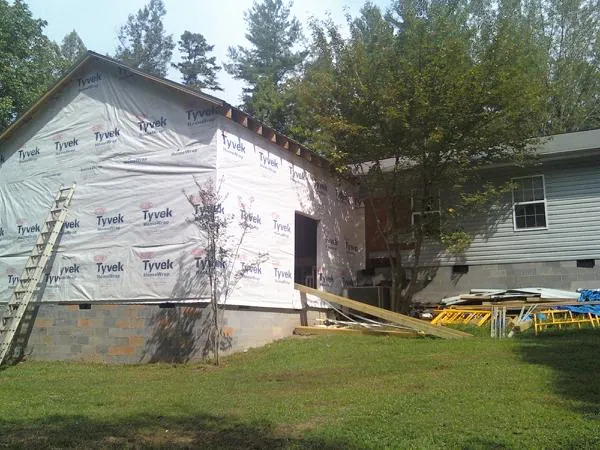 Tyvek wrapped gable on a new room addition beside an existing home in Lakeside